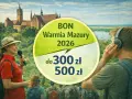 BON Warmia Mazury 2026 do 300-500 zł. Grupa turystów z przewodniczką zwiedza zamek.