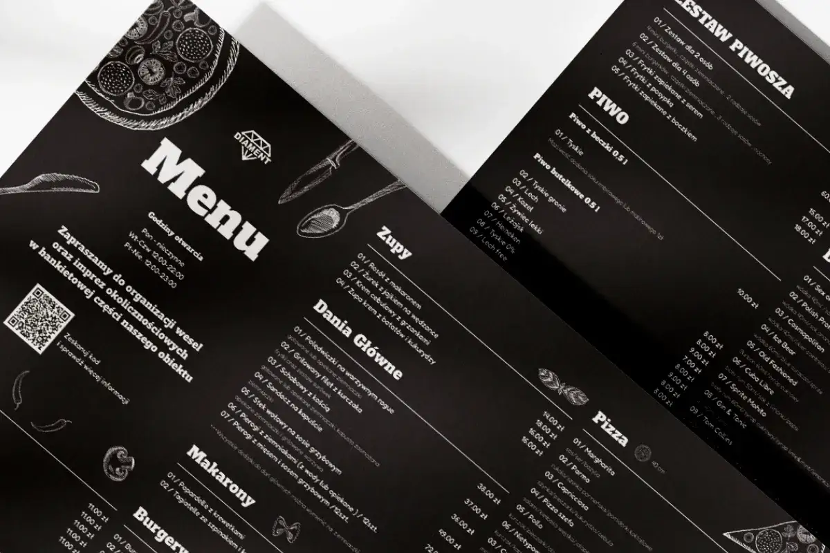 Czarne menu restauracji z białymi napisami. Widoczna sekcja 
